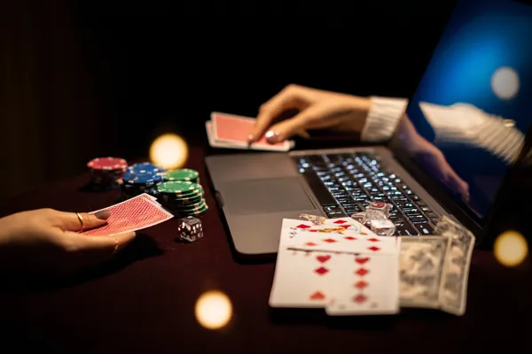 A player using their smartphone during a festive local event, representing 6363PH’s fully mobile-friendly casino.